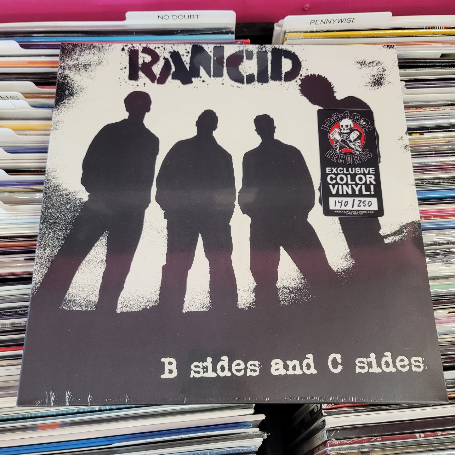 USED: Rancid - B-Sides and C-Sides LP record (glow in the dark splatter vinyl)