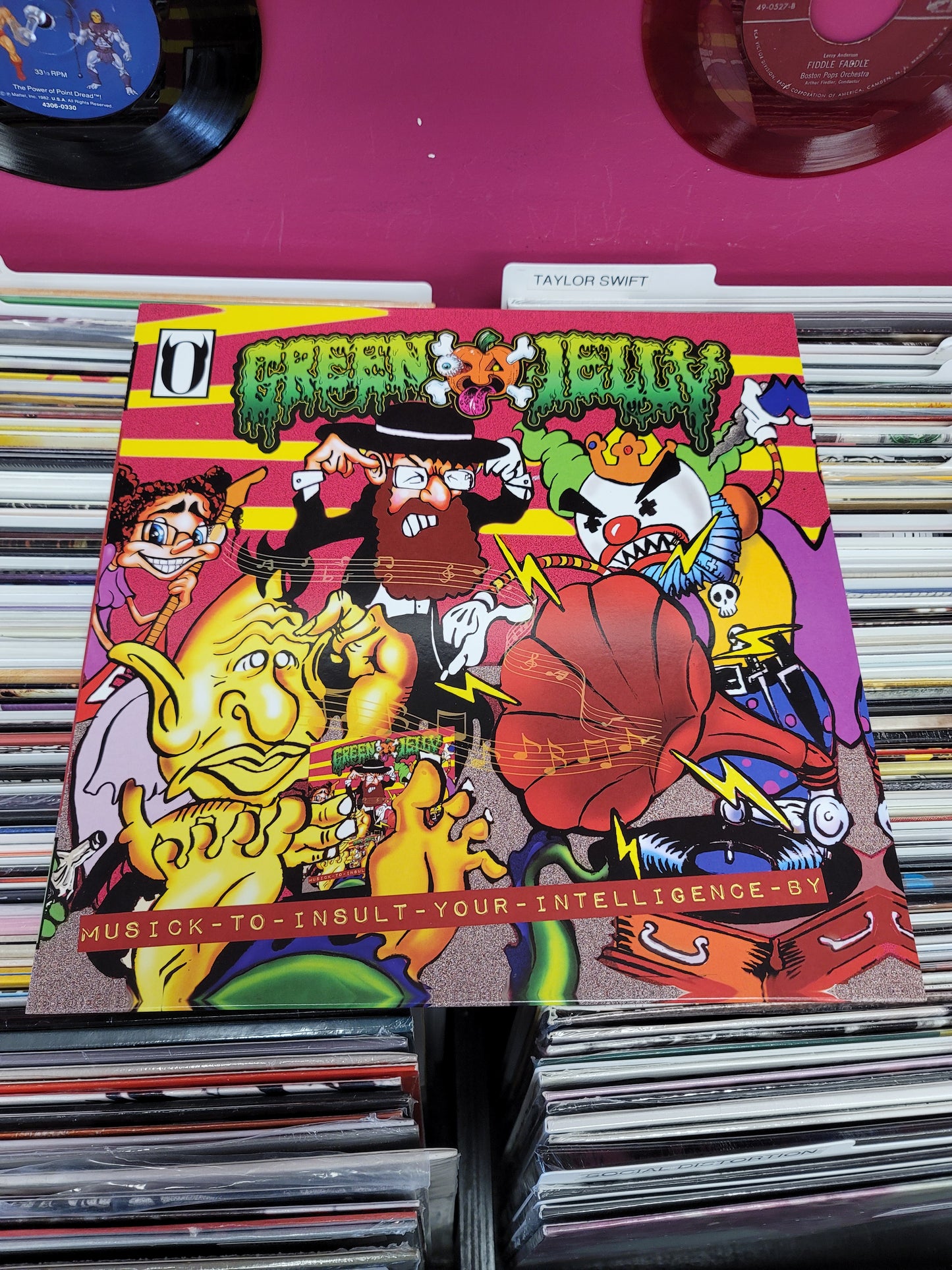 USED: Green Jelly - Musick To Insult Your Intelligence LP record (orange vinyl w/ black splatter)