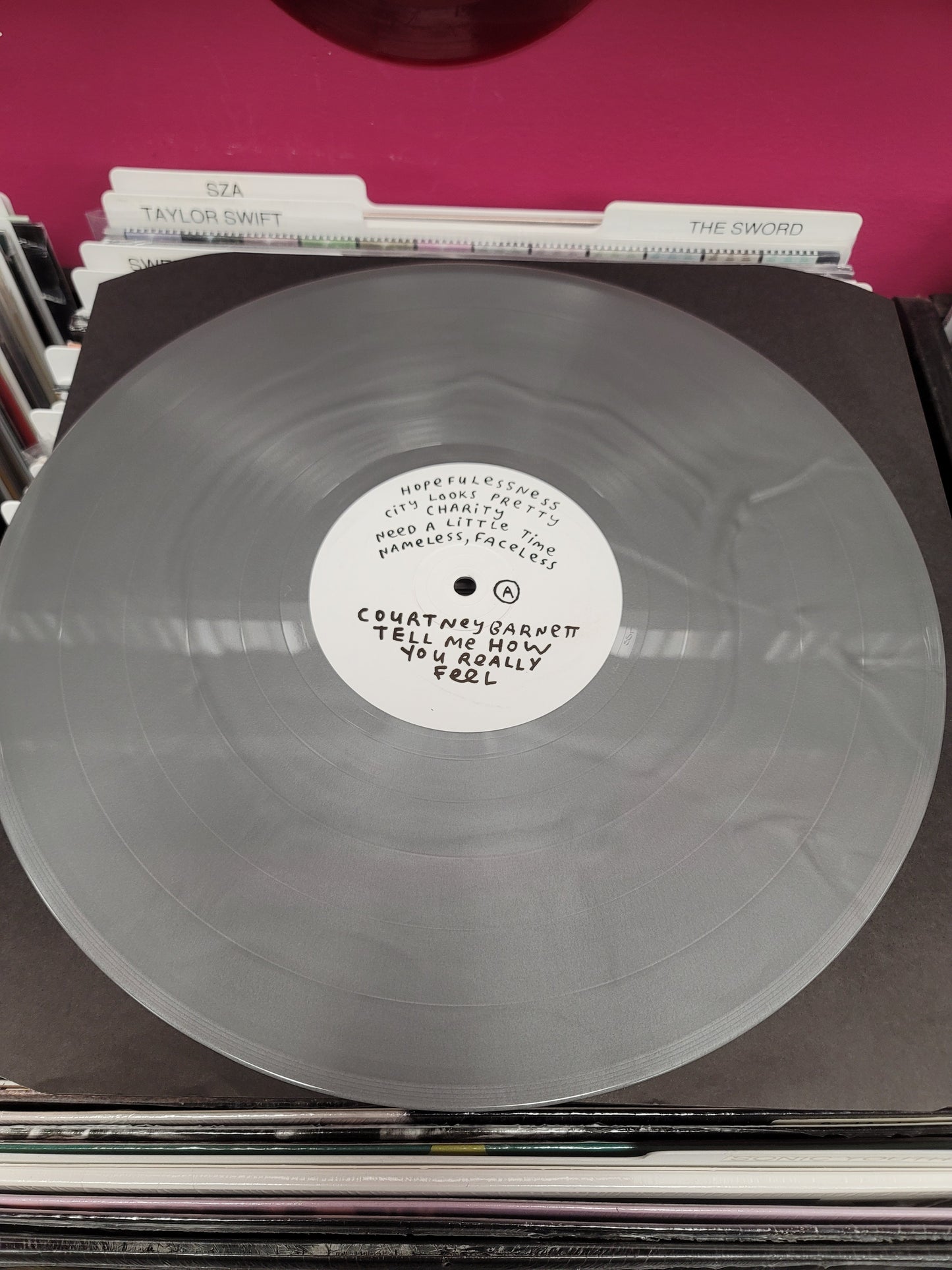 USED: Courtney Barnett - Tell Me How You Really Feel LP record (silver vinyl)