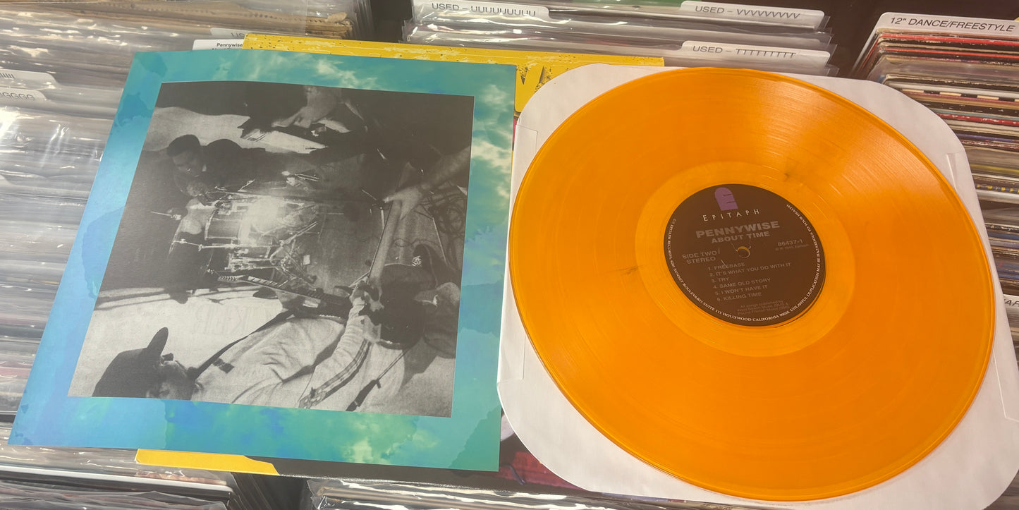 USED: Pennywise - About Time LP record (translucent yellow vinyl)