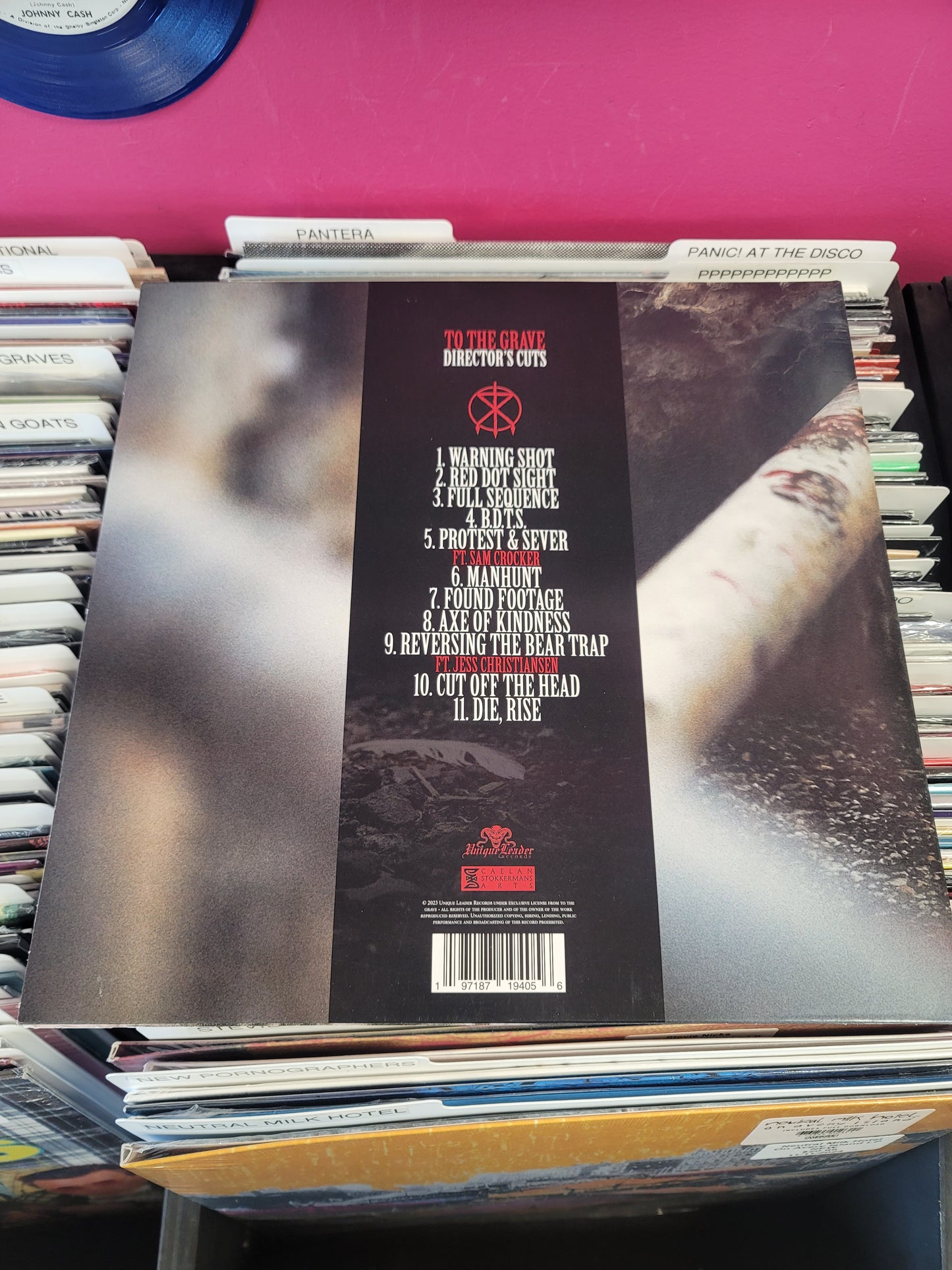 USED: To The Grave - Director's Cuts LP record (clear vinyl w/ red splatter)