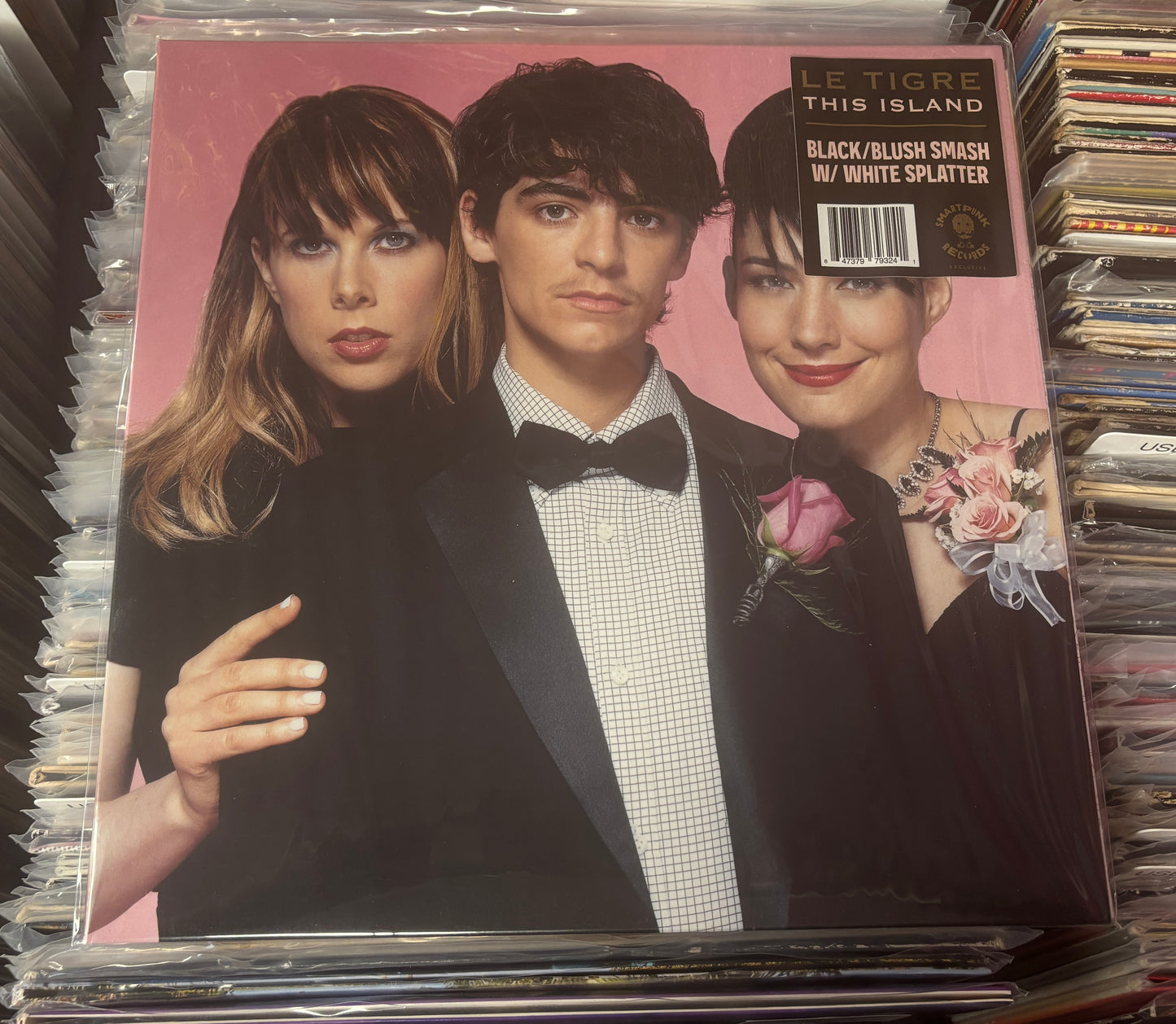 USED: Le Tigre - This Island LP record (black/blush w/ white splatter vinyl)