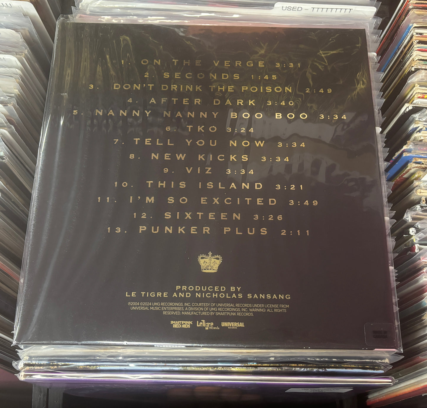 USED: Le Tigre - This Island LP record (black/blush w/ white splatter vinyl)