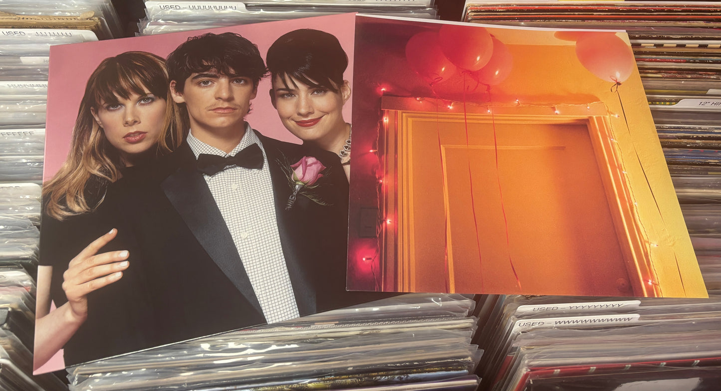 USED: Le Tigre - This Island LP record (black/blush w/ white splatter vinyl)