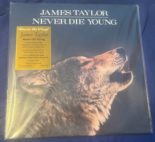 USED: James Taylor - Never Die Young LP vinyl record (MOV pressing on white & black marbled)